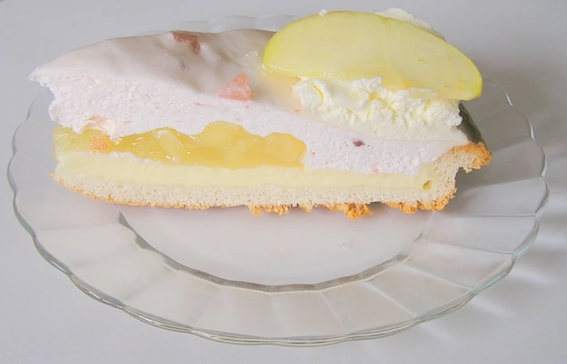 a piece of cake with lemon and frosting