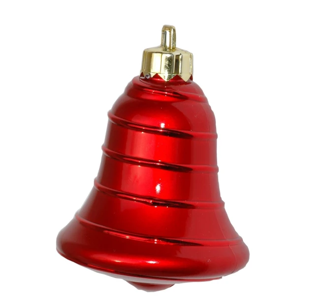 a shiny red bell hangs on a wire