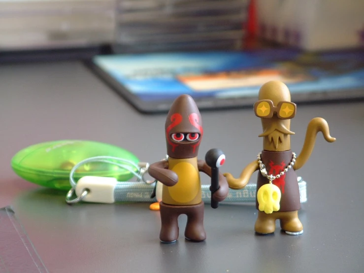 a pair of small action figures on a table