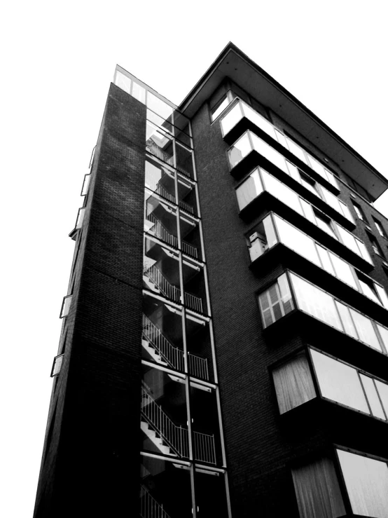 a black and white po shows the outside of an apartment building