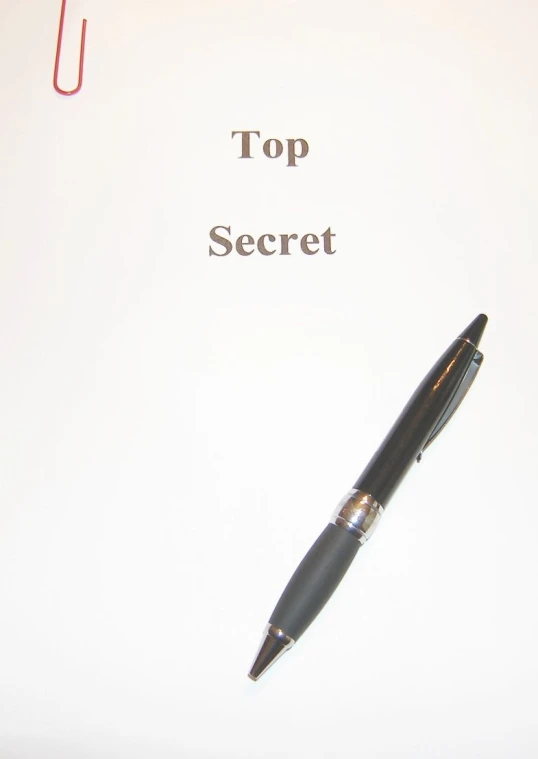 the top secret note has a pen on it