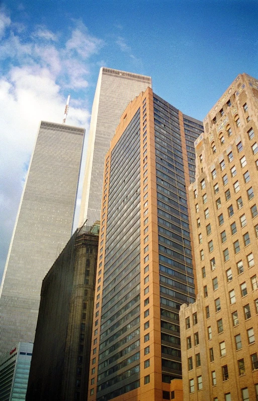 tall buildings are in a city and against the blue sky