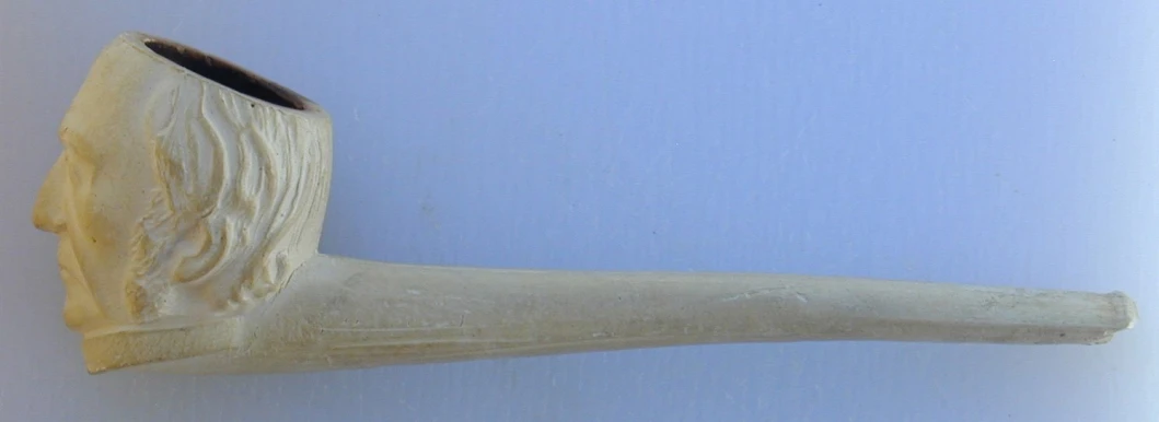 a close up of a white pipe with a blue sky behind it