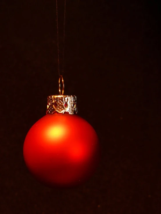 an ornament is hanging upside down in the dark