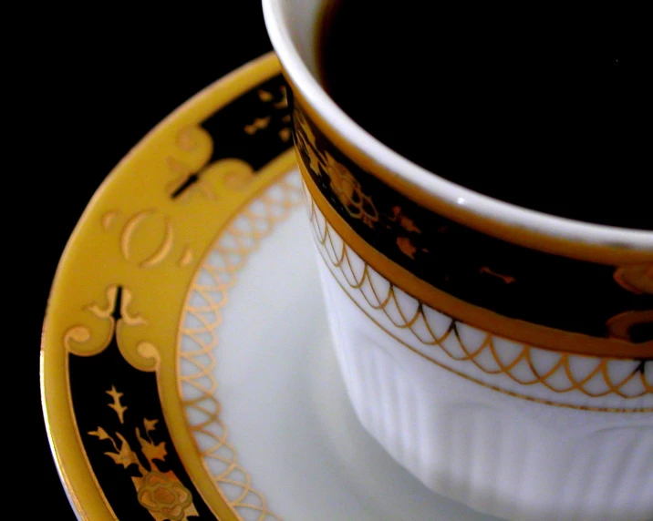 a close - up image of a coffee cup in a yellow and black design