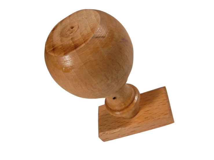 a wooden object made out of wood and standing on top of a wooden stand