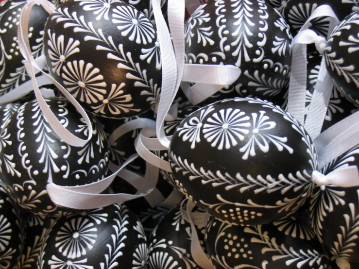 this is a pile of decorative black and white eggs