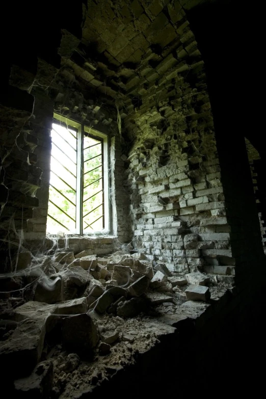 the inside of a ruined room with an empty window