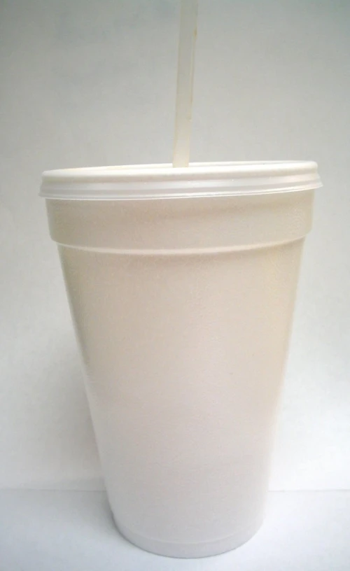 a cup with a straw sticking out of it