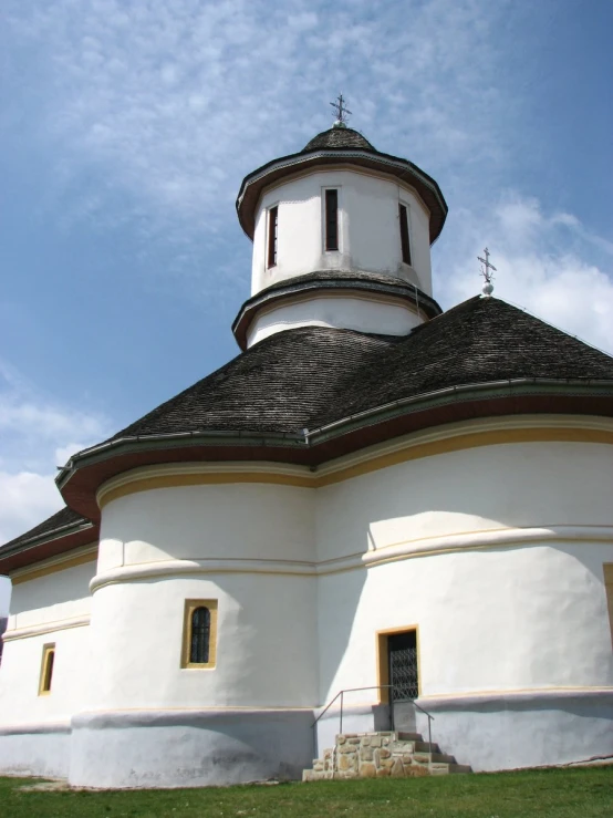 there is a church with black and white decorations on the roof