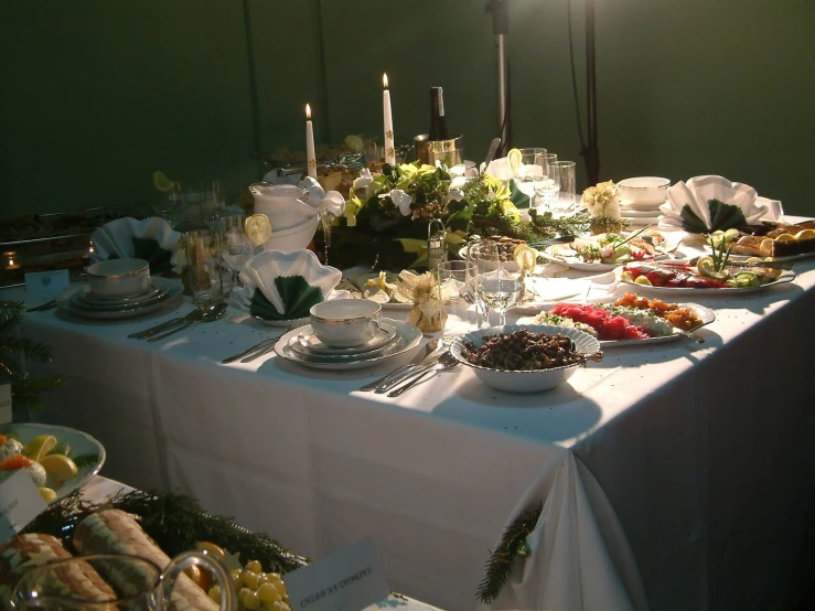 an elegant table filled with plates and dishes