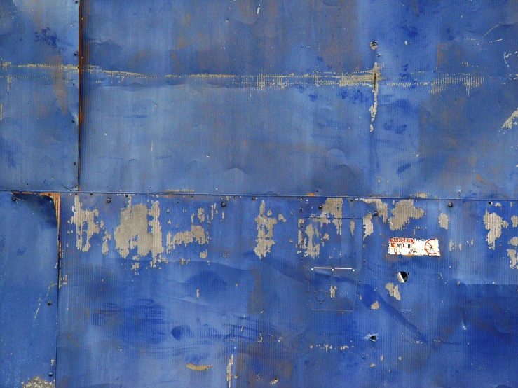 there is some peeling paint that has become blue