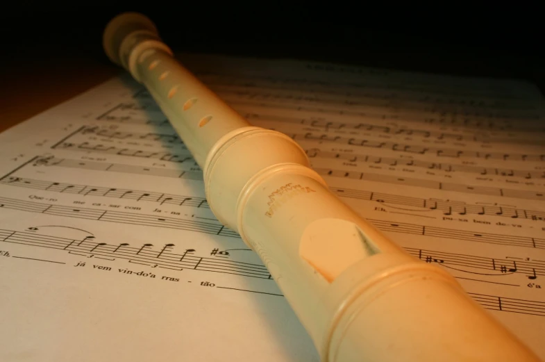 a pen on top of sheet music notes