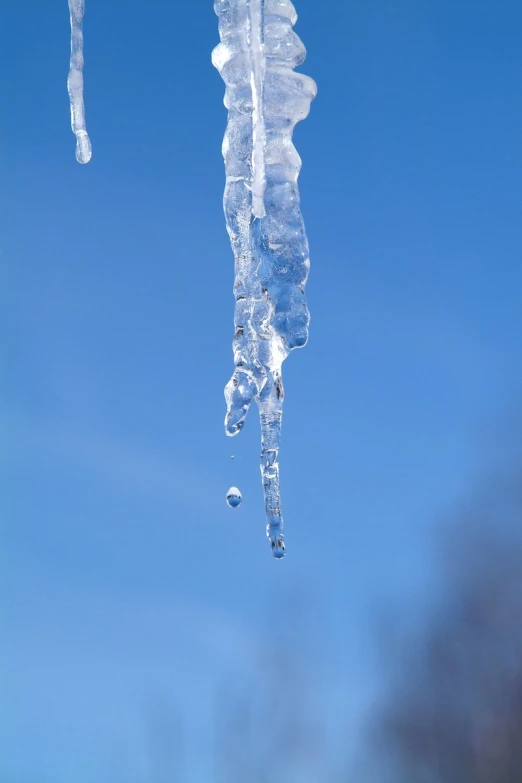 icicles of ice and water hanging from roof