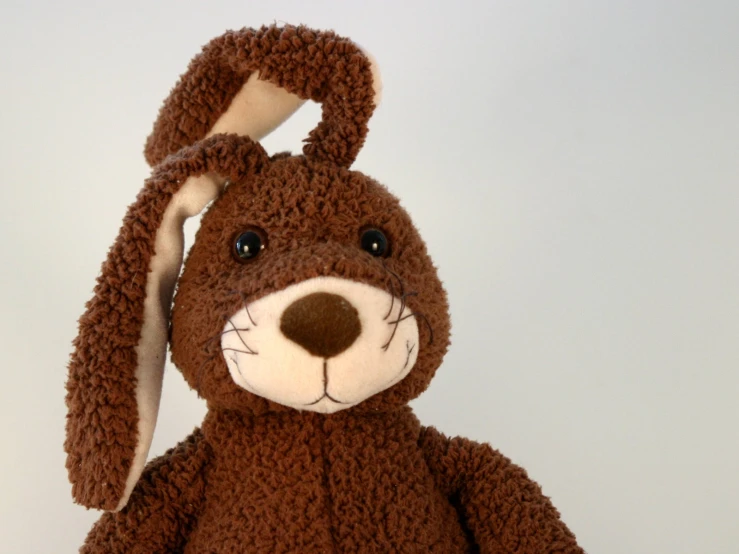 the small brown rabbit stuffed animal has white ears