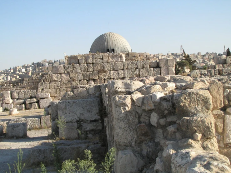 the ruins of a large city covered in stones