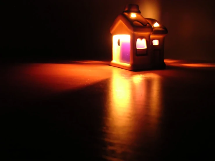 two lights are shining on the house next to the floor