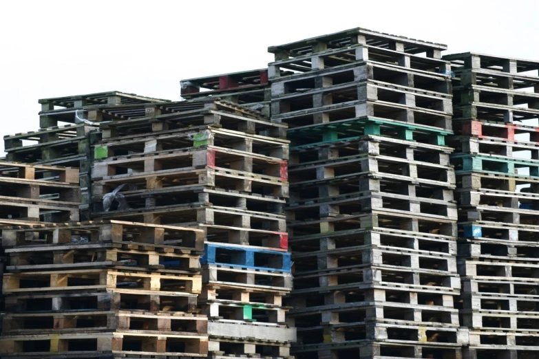 large buildings made of wooden pallets on top of each other