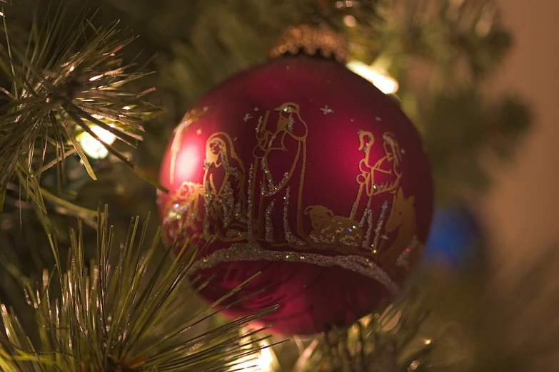 an ornament on top of a christmas tree