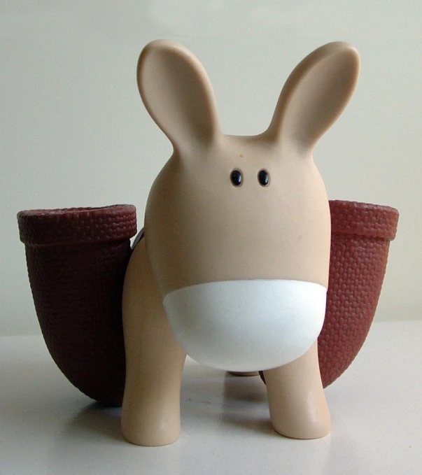 a plastic toy of a bunny rabbit with ears