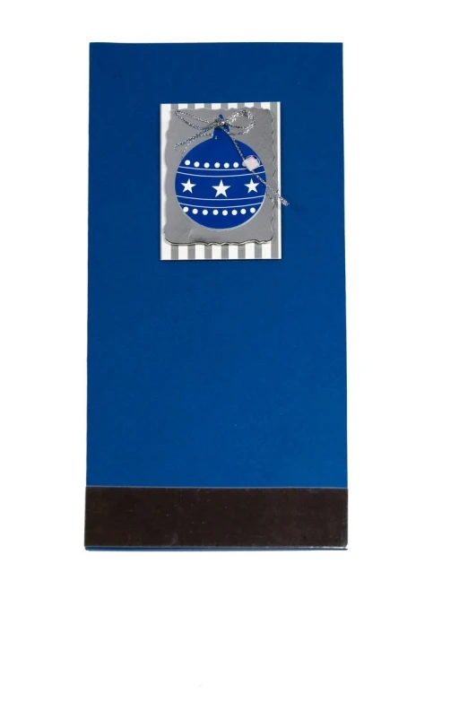 an ornament on blue card in its gift bag