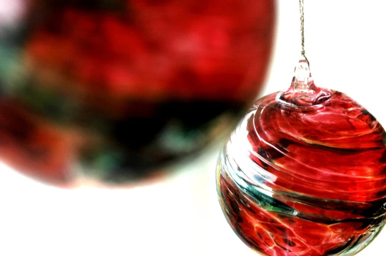 a closeup of the top of a glass ball and an apple