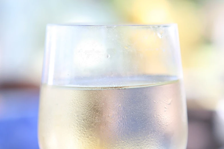 close up s of a beverage glass, with liquid in it