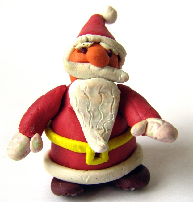 santa claus figure standing in front of a white background