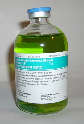 the bottle is full of green liquid