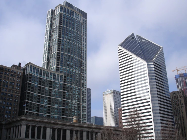 skyscrs and office buildings stand in a city