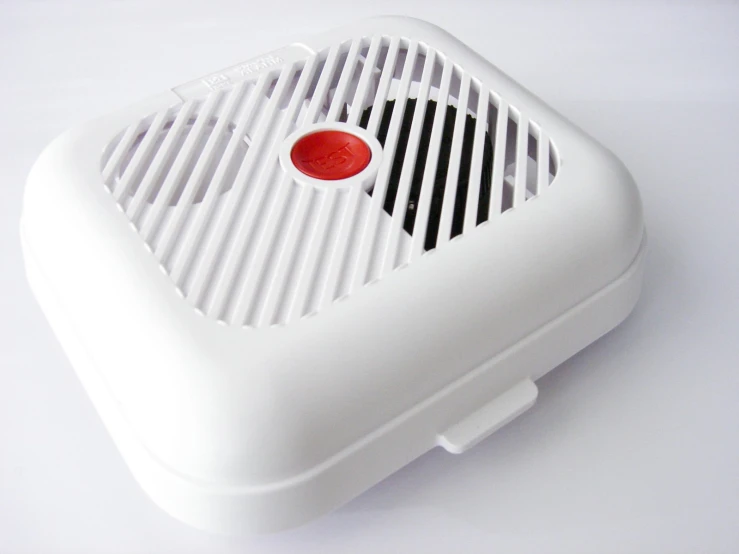 a white object with a red object on top