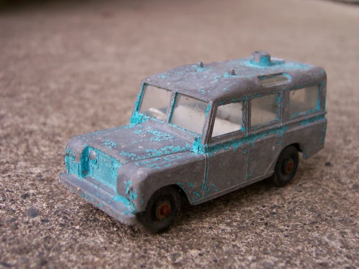 toy van sitting on the ground with no one inside