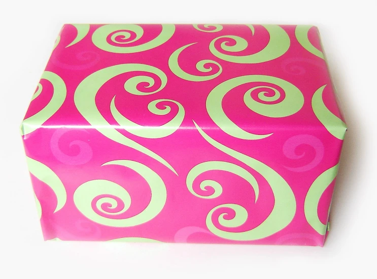 pink and green box with white swirls