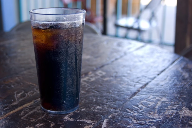 there is ice and some soda on the table