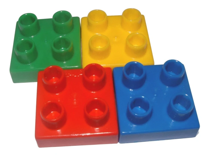 four lego blocks that have different colors