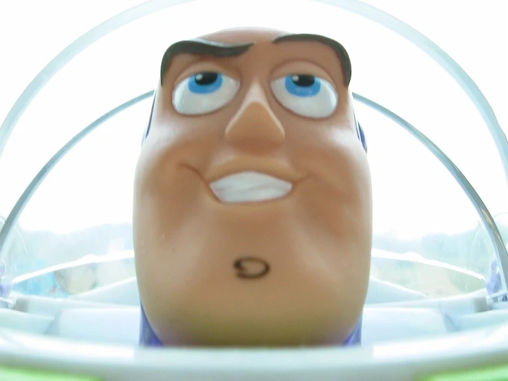 the head of an animated character looking into a camera