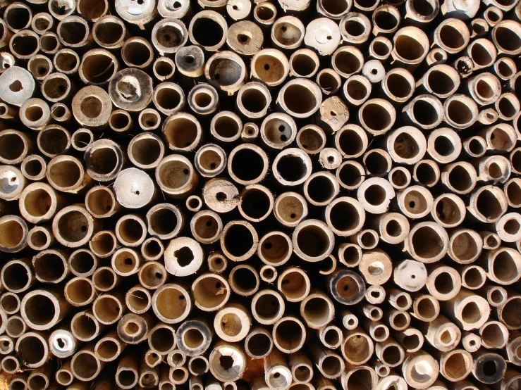 closeup of tubes that are being stacked and stacked