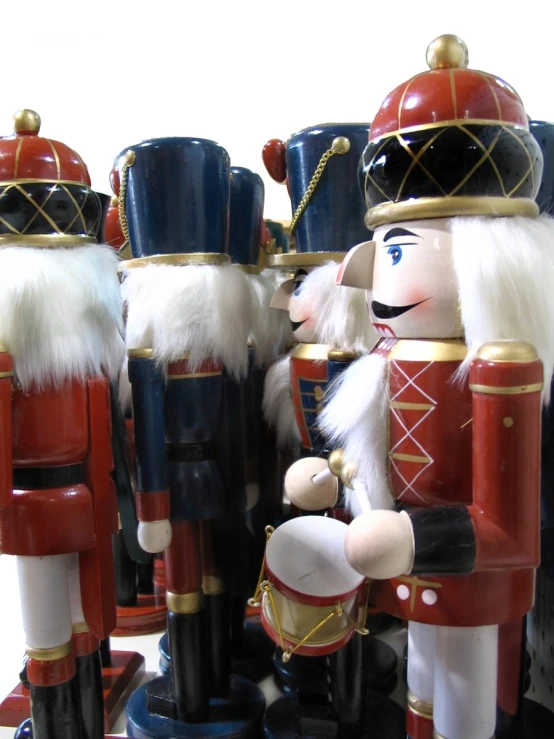 three toy soldiers in their uniforms made of ceramic