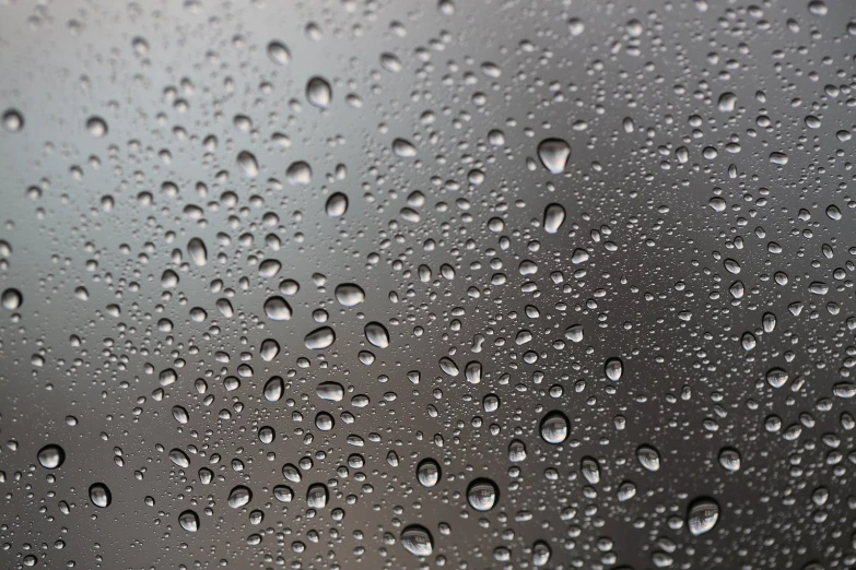 rain drops are on the surface of the window