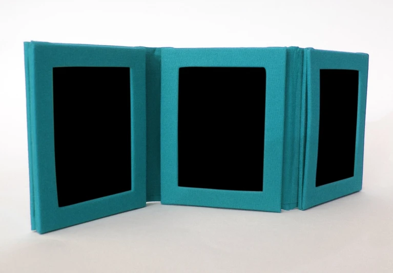 an open book with two black frames on top