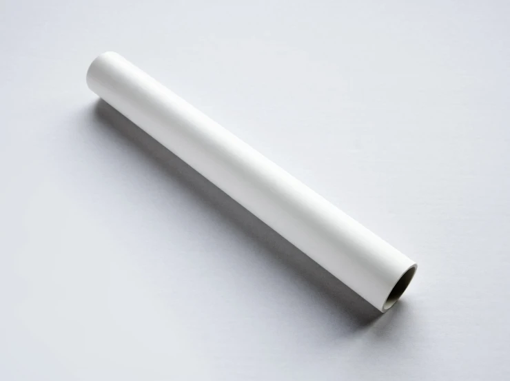 white plastic tube lying on top of a table