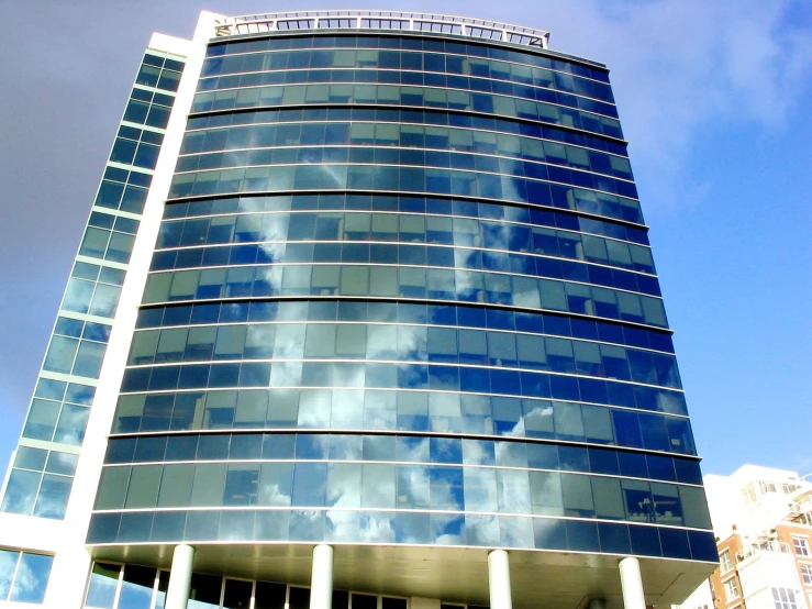 large building with many windows against cloudy sky