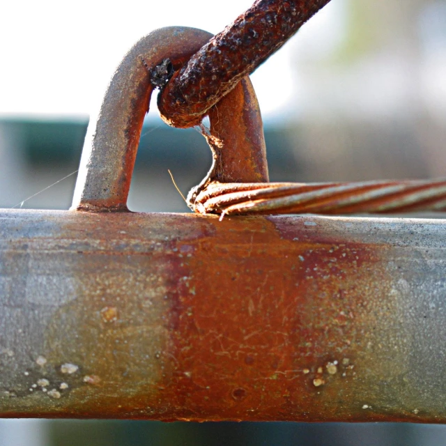 rusty rusted steel ring with a single metal link