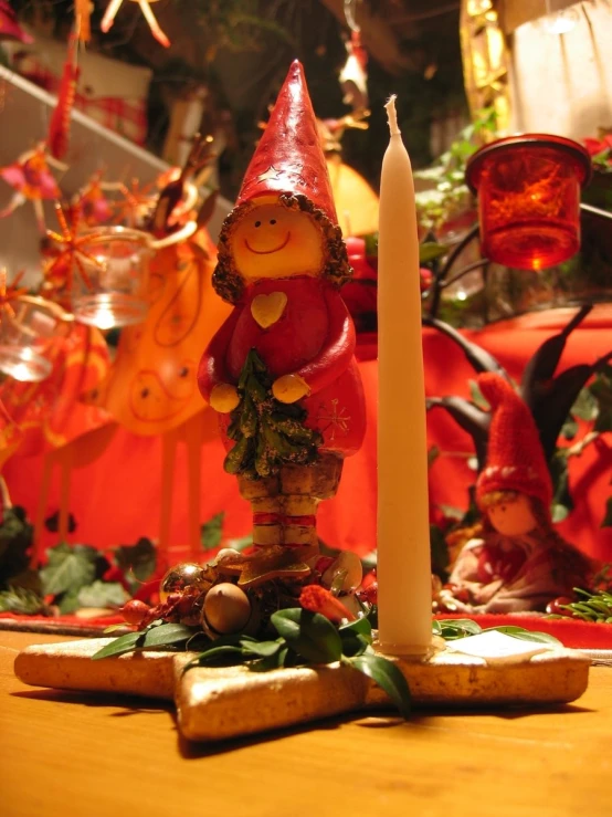 a wooden spoon filled with vegetables sitting on top of a wooden table