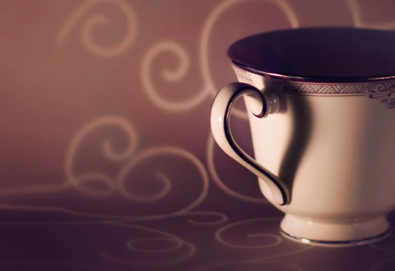 a picture of a coffee cup with an artistic pattern on the side