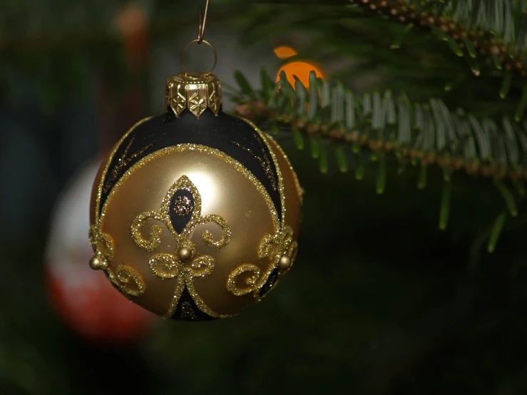 an ornament hanging from a christmas tree on the corner