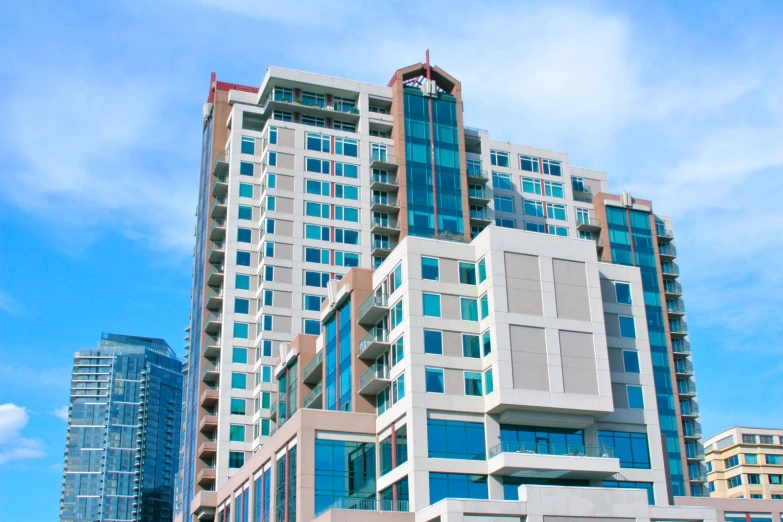 a multi - story office building with multiple balconies and windows on each of it