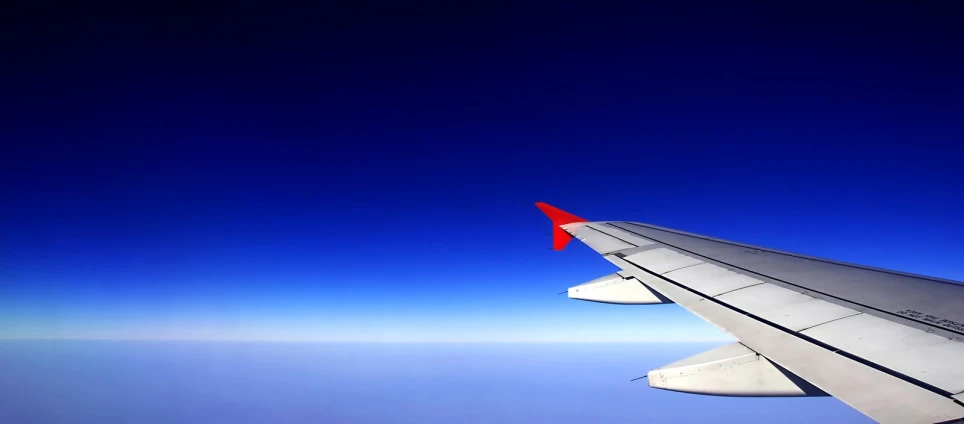an airplane wing is seen from inside the plane