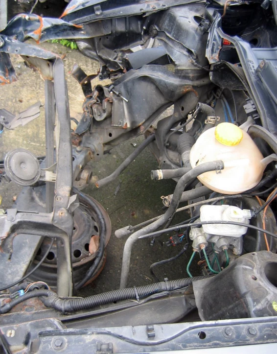 a engine compartment of a car with its hood lifted