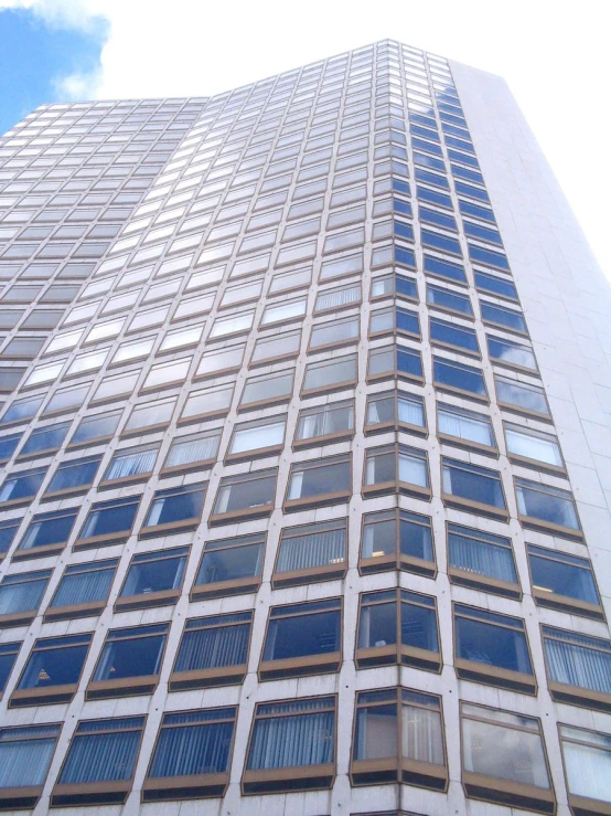 a tall building with lots of windows and the sky